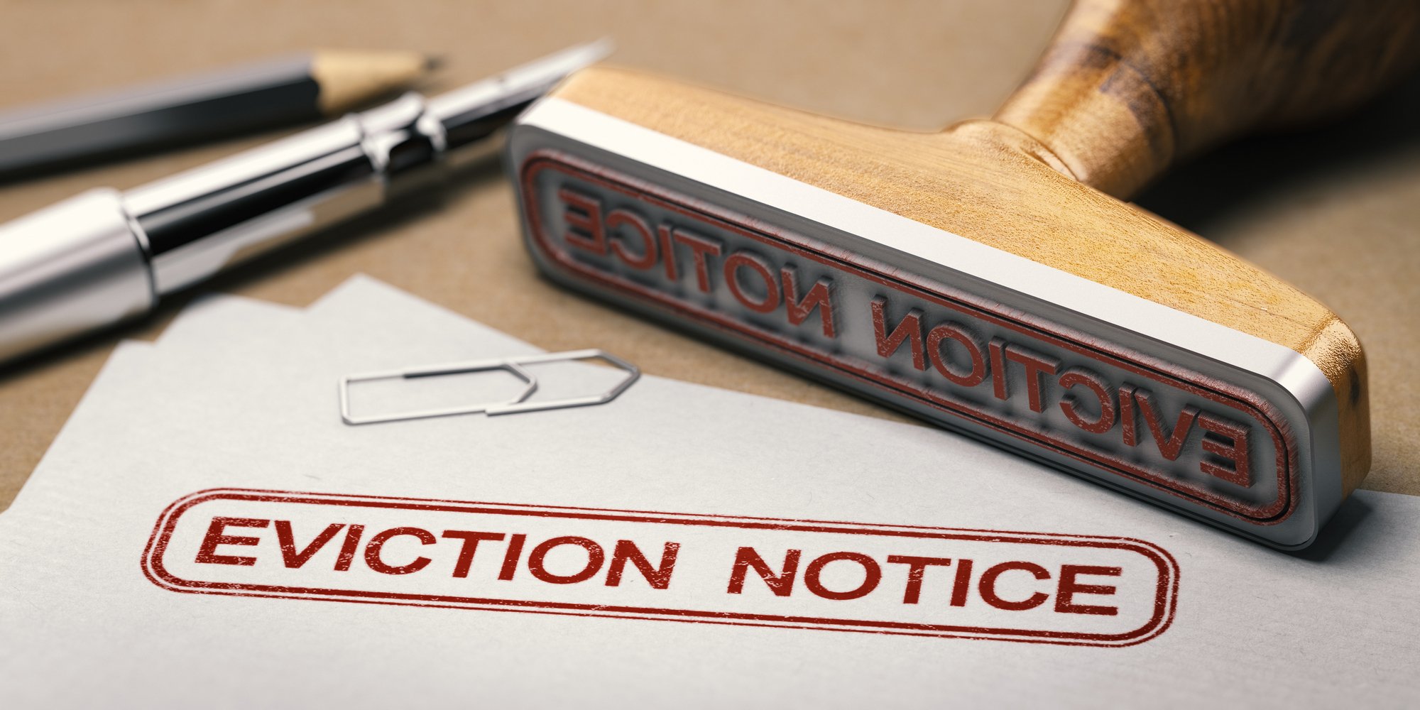 3D illustration of a rubber stamp with the text eviction notice printed on a document