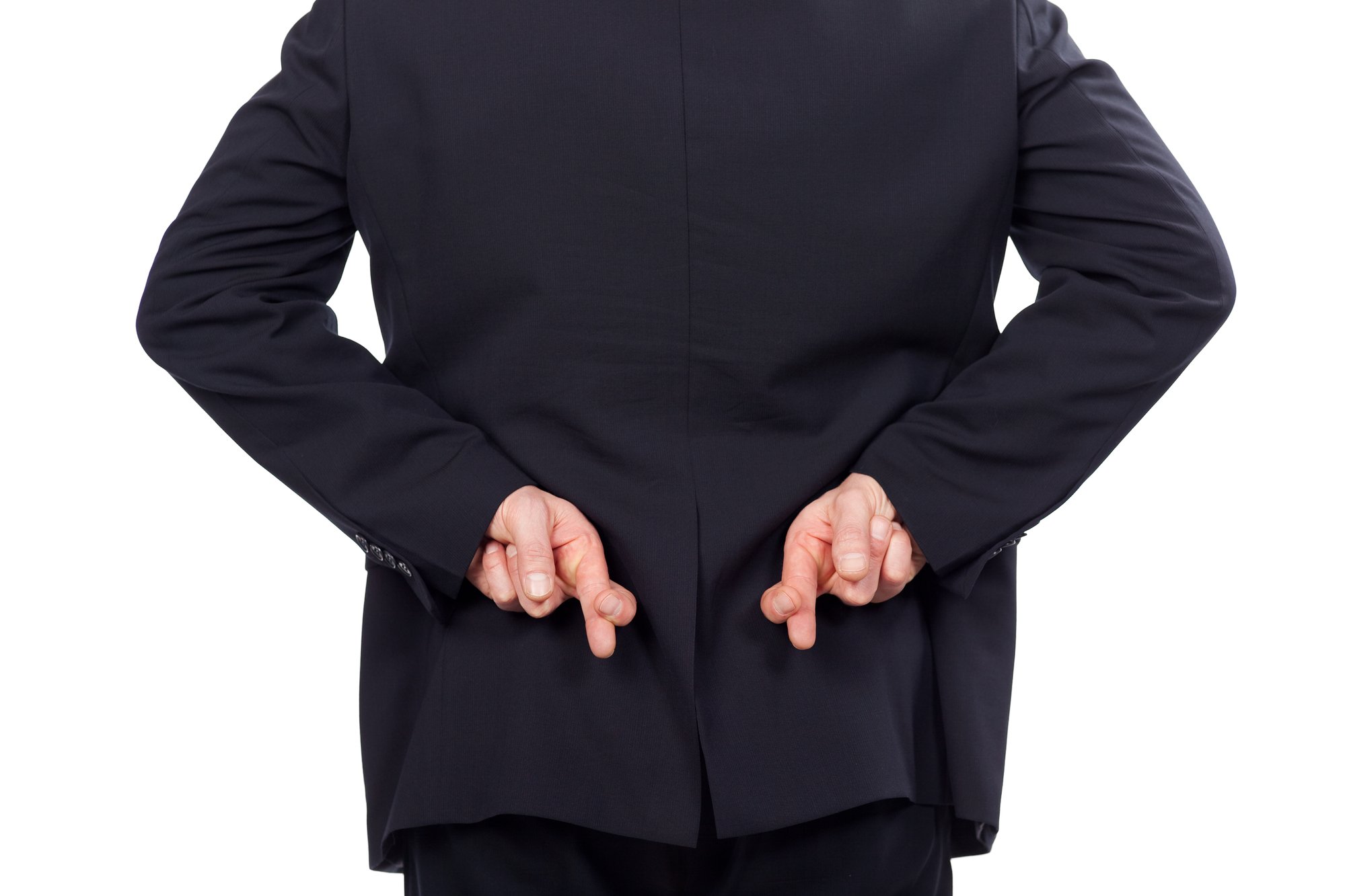 Businessman crossing his fingers
