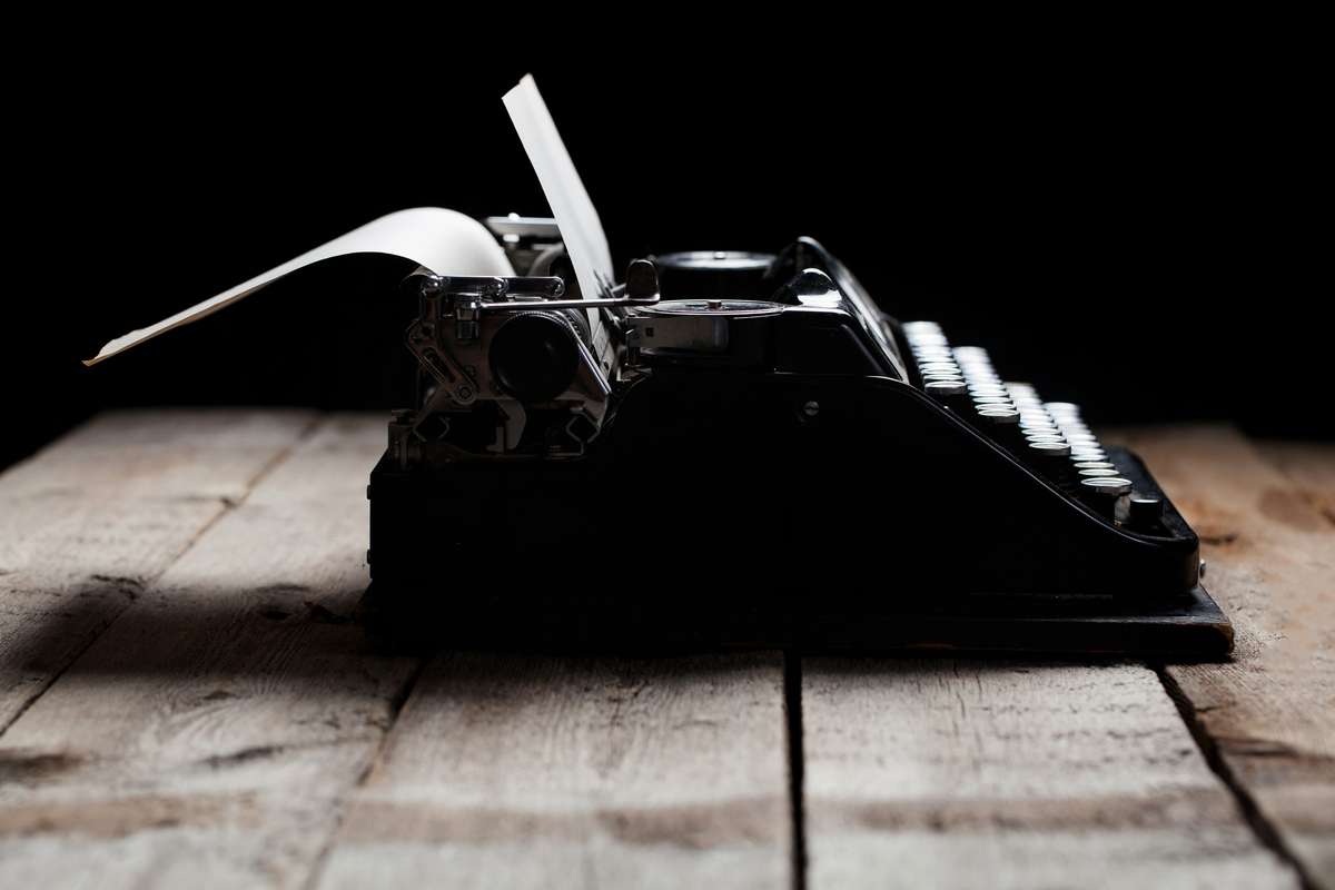 Old typewriter on a wooden table (R) (S)